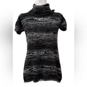 Woman’s turtle neck light sweater!